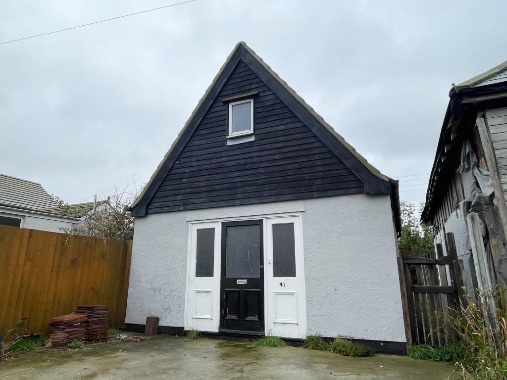 Lot: 101 - DETACHED BUILDING WITH POTENTIAL - Front elevation of the former workshop building converted without planning permission